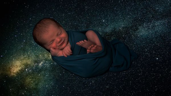 Giggling baby with decorative starry background