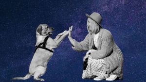 Woman and dog appearing to high-five with decorative starry background