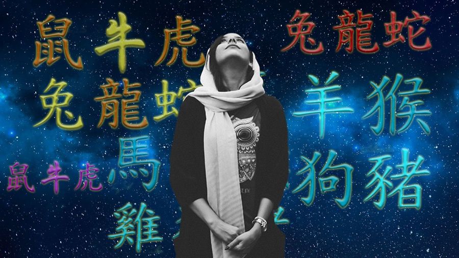 Woman wearing shawl looking upwards and thinking with background of neon Chinese characters representing Chinese zodiac signs and starry background